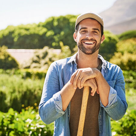 a man gardening and smiling
