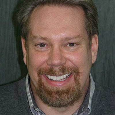 Man smiling after effective dental treatment