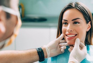 woman smiling during cosmetic consultation