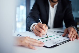 People go over insurance paperwork