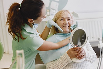 Dentures patient in San Marcos smiling at dentist