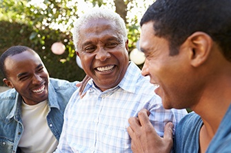 Dentures patient in San Marcos talking with family