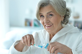 Patient in San Marcos getting ready to clean their dentures