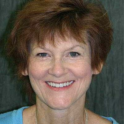 Woman smiling after dental checkup and teeth cleaning visit