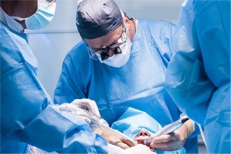 Dentists conducting a dental implant surgery