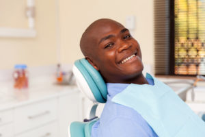 man smiling in dentist chair 