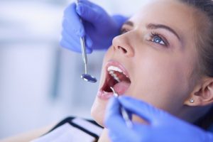 woman getting dental exam