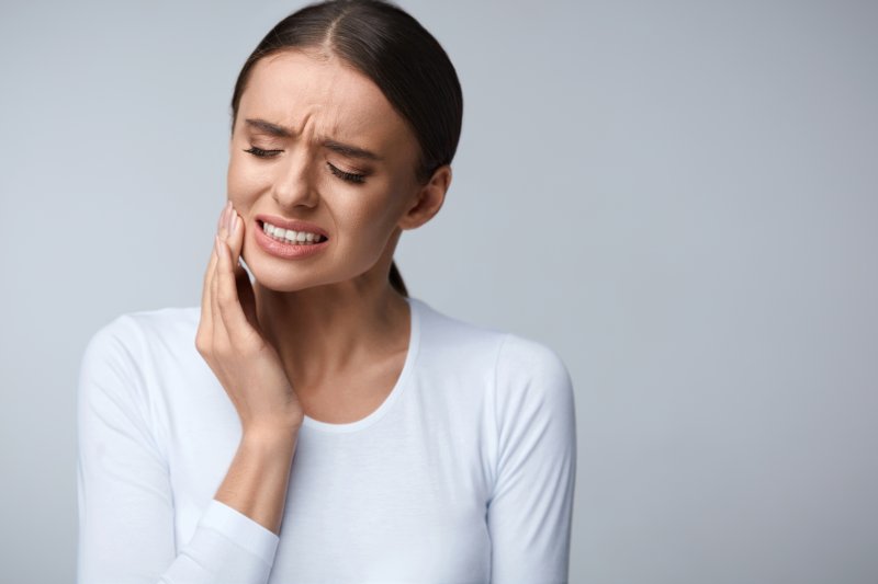 Woman with toothache needing to see dentist