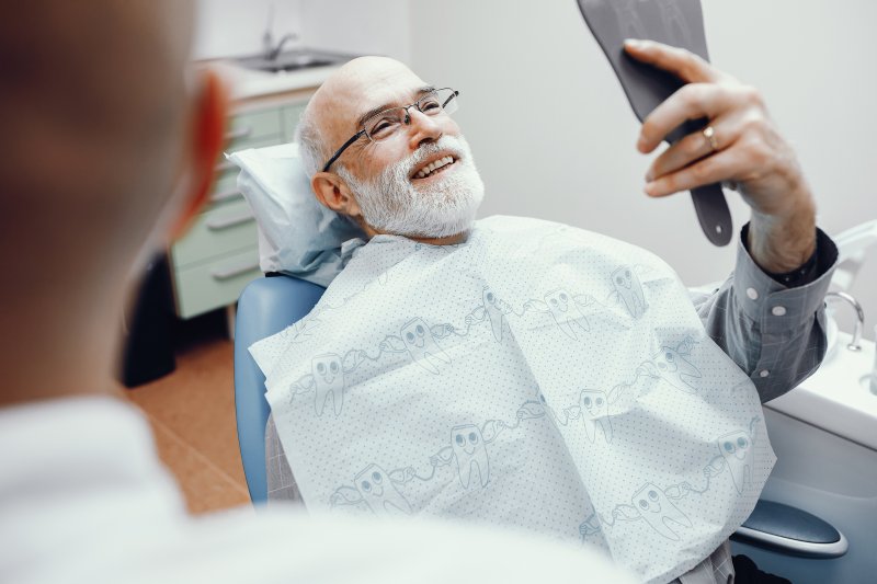 Man with mini dental implants at dentist