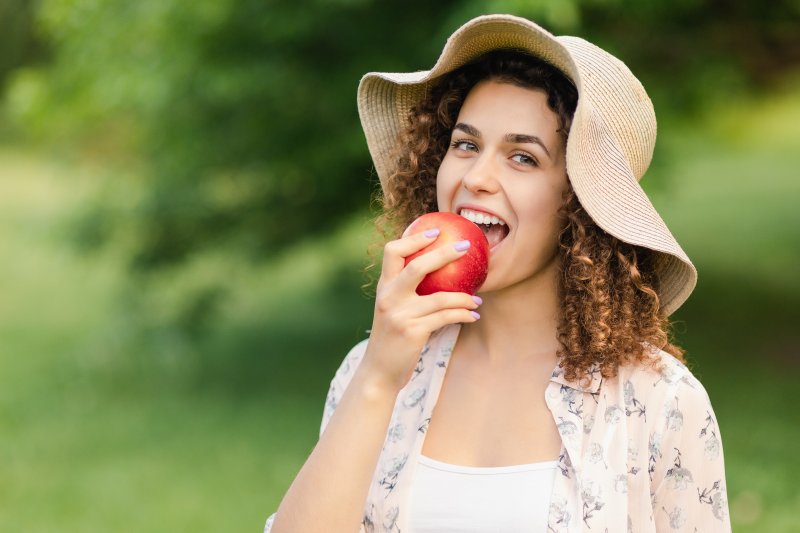 Woman eating apple