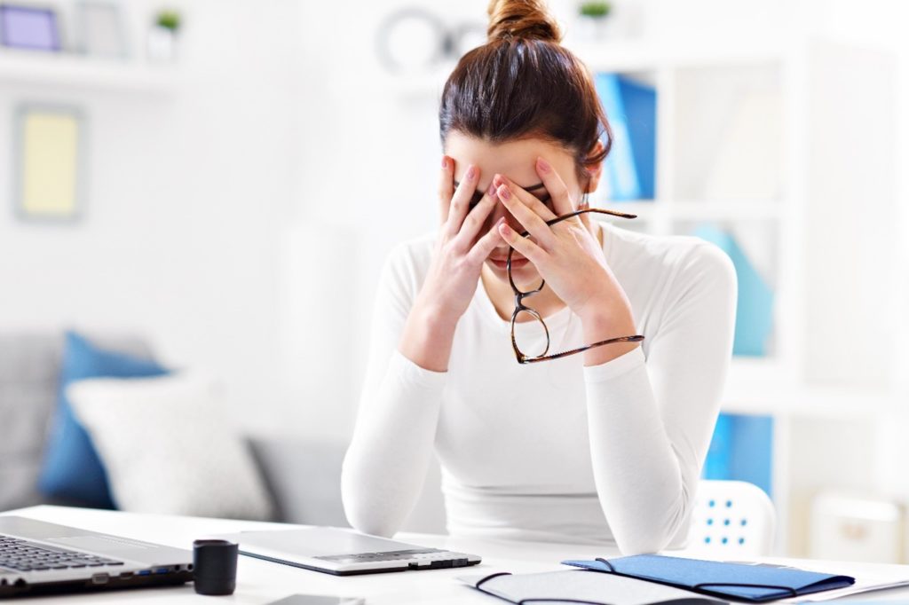 A woman is stressed about her mental health.