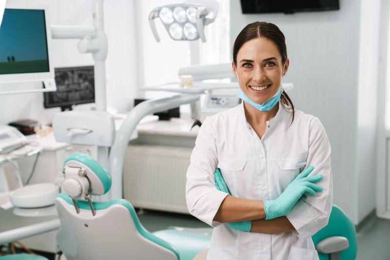 Smiling dentist crossing her arms