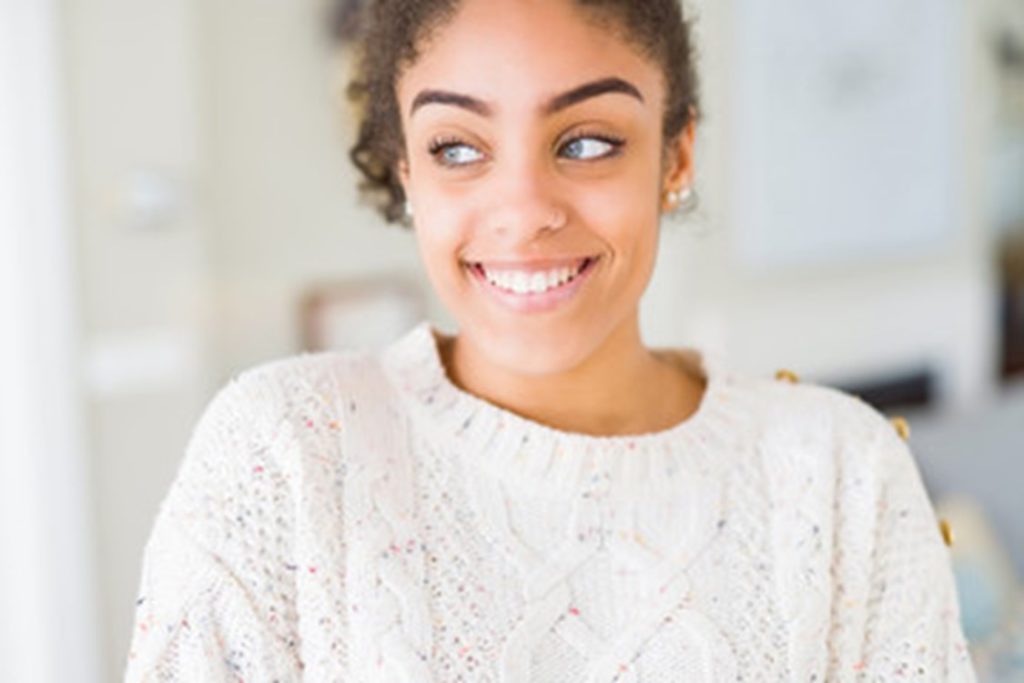 person who underwent gum recontouring smiling