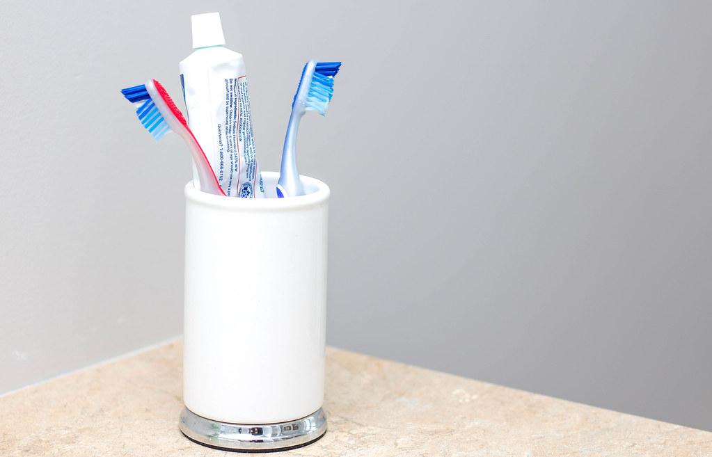 toothbrush holder with toothbrushes in it