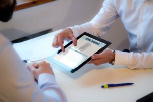 Two people looking over a dental insurance form.
